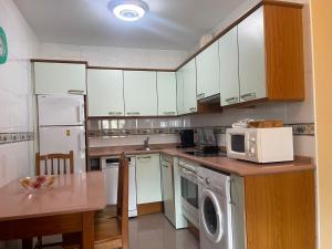 Dapur atau dapur kecil di Apartamento Cinema