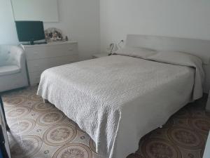 Postel nebo postele na pokoji v ubytování Casa di Via Roma