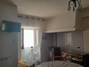 Kuchyň nebo kuchyňský kout v ubytování Casa di Via Roma