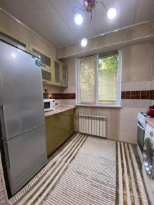 Kuchyň nebo kuchyňský kout v ubytování Apartment Plaza 2 х ком