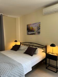 Postel nebo postele na pokoji v ubytování Apartments Villa Dinka
