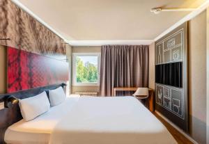 Postel nebo postele na pokoji v ubytování B&B HOTEL Rothrist Olten