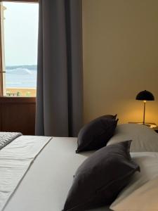 Postel nebo postele na pokoji v ubytování Apartments Villa Dinka