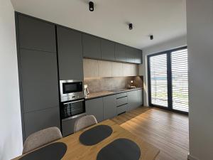 Kuchyň nebo kuchyňský kout v ubytování Apartmán MDK
