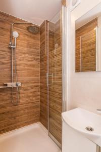 a bathroom with a shower and a sink at Yvonne in Krk +35 photos