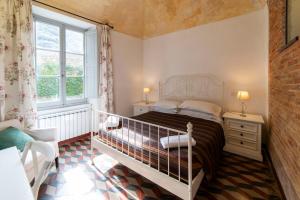Letto o letti in una camera di Ca di Ni