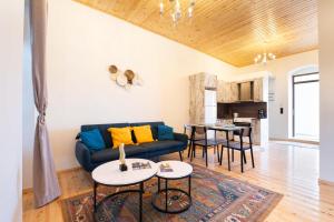 a living room with a couch and a table at Mani view luxury house in Agios Nikolaos