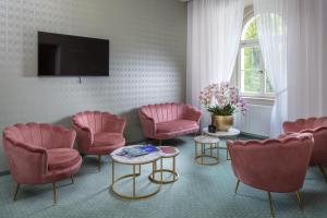 TV a/nebo společenská místnost v ubytování Esplanade, dependance hotelu Monti Spa