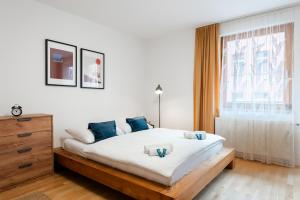 Posteľ alebo postele v izbe v ubytovaní Bliss Apartment
