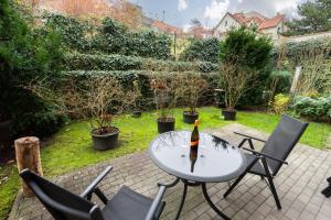 Vonkajšia záhrada v ubytovaní Bliss Apartment