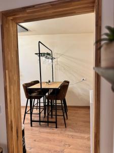 a dining room with a table and chairs at Factory Loft Eifel in Leimbach