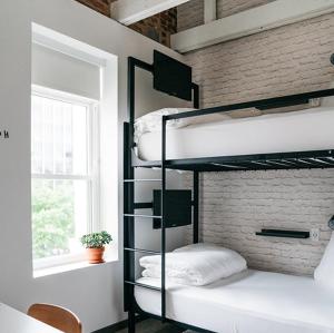 Postel nebo postele na pokoji v ubytování Hotel Hive