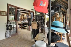 a store with a bunch of hats on display at Kwa Maritane Lodge in Ledig