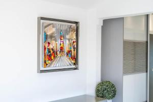 a picture of a painting on a wall at Studio Love Room Rooftop Jacuzzi SCLS Rentals in Cannes