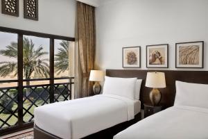 Aldhafra Resort, Vignette Collection by IHG客房内的一张或多张床位