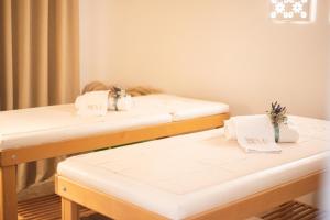 Łóżko lub łóżka w pokoju w obiekcie Marenea Suite Hotel - CDSHotels