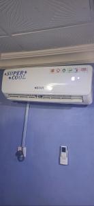 a phone is hanging from the ceiling of a room at promise hotel gbagada in Lagos