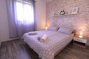 Postel nebo postele na pokoji v ubytování Apartments Mima