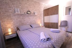 Postel nebo postele na pokoji v ubytování Apartments Mima