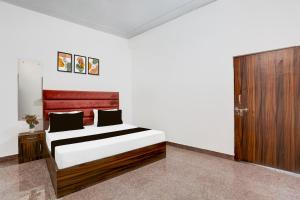 Postel nebo postele na pokoji v ubytování HOTEL O RAJENDRA PALACE