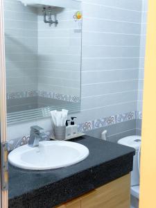 a bathroom with a sink and a toilet at Chiri Homestay in Thôn Trường Giang +30 photos