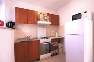 Kuchyň nebo kuchyňský kout v ubytování Apartments Mima