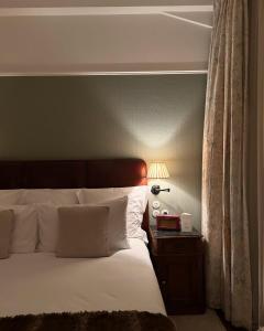 Voodi või voodid majutusasutuse Hotel Atlantiis Suites Near IGI Airport toas