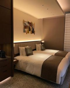Voodi või voodid majutusasutuse Hotel Atlantiis Suites Near IGI Airport toas