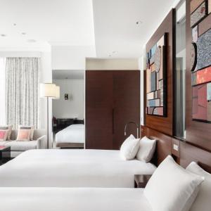 Voodi või voodid majutusasutuse Hotel Atlantiis Suites Near IGI Airport toas