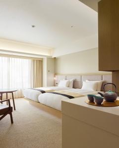 Voodi või voodid majutusasutuse Hotel Atlantiis Suites Near IGI Airport toas