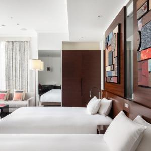 Voodi või voodid majutusasutuse Hotel Atlantiis Suites Near IGI Airport toas