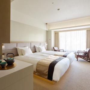 Voodi või voodid majutusasutuse Hotel Atlantiis Suites Near IGI Airport toas