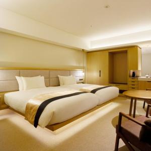 Voodi või voodid majutusasutuse Hotel Atlantiis Suites Near IGI Airport toas