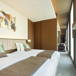 Voodi või voodid majutusasutuse Hotel Atlantiis Suites Near IGI Airport toas