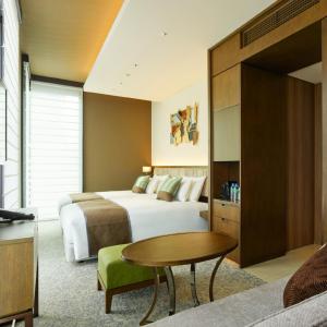 Voodi või voodid majutusasutuse Hotel Atlantiis Suites Near IGI Airport toas