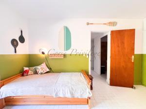 En eller flere senge i et værelse på Maison Porticcio centre