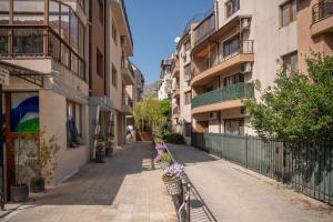 an empty street in a city with buildings at Breeze Atelier in Varna City