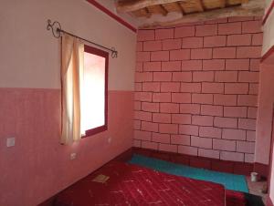 Postel nebo postele na pokoji v ubytování Dar Laayoune