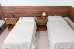 Postel nebo postele na pokoji v ubytování Hotel Pousada Bonita - 150m Metrô Paraiso e 1Km do inicio Av Paulista
