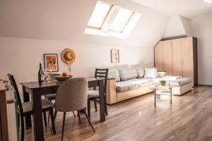 a living room with a table and a couch at Breeze Atelier in Varna City