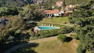 an aerial view of a house with a swimming pool at Posada los Cedros in La Cumbre +69 photos