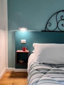 Postel nebo postele na pokoji v ubytování DIMOR'A' ROOMS