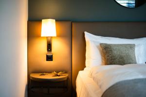 Katil atau katil-katil dalam bilik di Hotel Seepark Thun