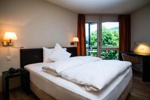 Katil atau katil-katil dalam bilik di Hotel Seepark Thun