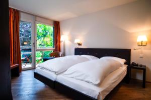 Katil atau katil-katil dalam bilik di Hotel Seepark Thun
