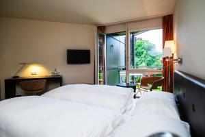 Katil atau katil-katil dalam bilik di Hotel Seepark Thun