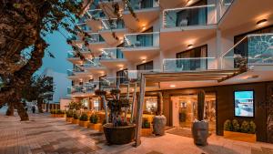 a facade of a building with stairs and plants at Essence Hotel Boutique in Torremolinos