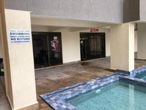 The swimming pool at or close to Coastal Serenity Suite Beach Front Apt