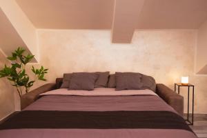 a large bed in a room with at Piazza Vittorio Luxury View in Turin