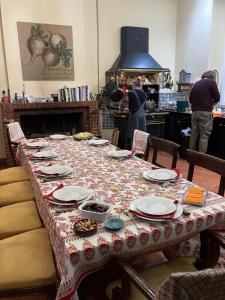a table in a kitchen with a table cloth on it at Château Gigault in Mazion